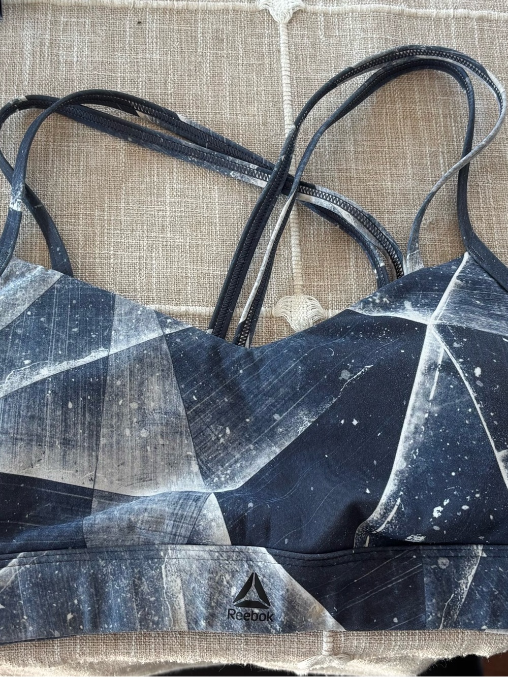 Reebok Geometric Strappy Sports Bra in Black and White